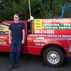 Aerating Thatching Company Owner Stewart Armour Red Truck