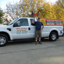 Aerating Thatching Company Owner Stewart Armour White Truck